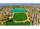 Aerial view of park with green spaces and lake in a vibrant community at 301 Resolute Ave, Henderson, NV 89011