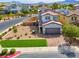 Charming two-story home with brick driveway, desert landscaping, and mountain views at 301 Resolute Ave, Henderson, NV 89011