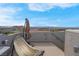 Scenic rooftop patio with a hammock, umbrella, and expansive views of the surrounding neighborhood at 301 Resolute Ave, Henderson, NV 89011