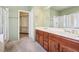 Lovely main bathroom features double sinks, walk-in shower and separate toilet room, with a neutral decor at 3029 Paseo Hills Way, Henderson, NV 89052