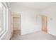 A sunlit bedroom with a closet and bathroom entrance at 3029 Paseo Hills Way, Henderson, NV 89052
