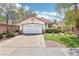 Charming single-story home featuring a well-maintained lawn and an attached two-car garage at 3029 Paseo Hills Way, Henderson, NV 89052