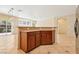 Kitchen island with cabinets and countertop seating next to the living space at 3029 Paseo Hills Way, Henderson, NV 89052