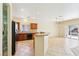 Modern kitchen with stainless steel appliances, ample cabinetry, and access to the backyard at 3029 Paseo Hills Way, Henderson, NV 89052