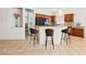Well-appointed kitchen with breakfast bar, granite countertops, and stainless-steel appliances at 3029 Paseo Hills Way, Henderson, NV 89052