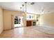 Bright living room with a sliding glass door and a fireplace at 3029 Paseo Hills Way, Henderson, NV 89052