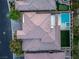 Aerial view of a beautiful home featuring a private pool, spa, and well-manicured landscaping at 42 Carolina Cherry Dr, Las Vegas, NV 89141