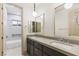 Bright bathroom with double sinks, modern mirrors and a large soaking tub and shower at 42 Carolina Cherry Dr, Las Vegas, NV 89141