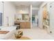 Bright bathroom features a soaking tub, vanity area, and access to the backyard at 42 Carolina Cherry Dr, Las Vegas, NV 89141