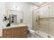 Modern bathroom with decorative gold hardware and glass enclosed shower at 42 Carolina Cherry Dr, Las Vegas, NV 89141