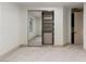 Spacious closet features full-length mirror and custom shelving that maximizes storage space at 42 Carolina Cherry Dr, Las Vegas, NV 89141