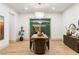 Open dining room with access to outdoor patio area, wood floors, and decoratively appointed table at 42 Carolina Cherry Dr, Las Vegas, NV 89141