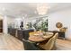Open floor plan featuring dining area, kitchen and living room with natural light and stylish finishes at 42 Carolina Cherry Dr, Las Vegas, NV 89141