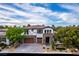 Stunning two-story home featuring a stone facade, a tiled roof, and a well-manicured front yard at 42 Carolina Cherry Dr, Las Vegas, NV 89141