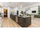 Open-concept kitchen with a large island, stainless steel appliances, and views of the living area at 42 Carolina Cherry Dr, Las Vegas, NV 89141