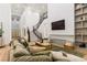 Inviting living area showcases a staircase, fireplace, high ceilings, and comfortable seating at 42 Carolina Cherry Dr, Las Vegas, NV 89141