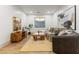 Cozy living room features neutral decor, hardwood floors, stylish furniture and a decorative rug at 42 Carolina Cherry Dr, Las Vegas, NV 89141
