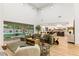 Spacious living room with high ceilings, hardwood floors, backyard views, and modern decor at 42 Carolina Cherry Dr, Las Vegas, NV 89141