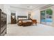 Spacious main bedroom with slider door access to the outdoor pool and patio area at 42 Carolina Cherry Dr, Las Vegas, NV 89141
