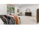 Large main bedroom featuring outdoor views, neutral decor, and modern furniture at 42 Carolina Cherry Dr, Las Vegas, NV 89141