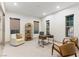 A bright office with modern desk, comfortable seating and large windows with views to the exterior at 42 Carolina Cherry Dr, Las Vegas, NV 89141