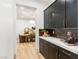 Stylish pantry with dark cabinetry and bright countertop, adjacent to the dining area at 42 Carolina Cherry Dr, Las Vegas, NV 89141