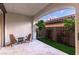 Outdoor patio with tiled floors, seating, and view of backyard landscape and hardscape at 42 Carolina Cherry Dr, Las Vegas, NV 89141