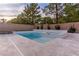 Gorgeous backyard features a modern style pool, a hot tub and ample patio space for entertaining at 42 Carolina Cherry Dr, Las Vegas, NV 89141