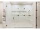 Beautiful glass walk-in shower features a built-in bench and multiple shower heads at 42 Carolina Cherry Dr, Las Vegas, NV 89141