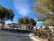 A quiet tree-lined street features well-maintained homes and manicured landscaping at 4675 Color Up Ct # 101, Las Vegas, NV 89122