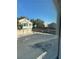 A peek through the window at the street and neighboring properties at 4675 Color Up Ct # 101, Las Vegas, NV 89122
