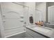 Clean bathroom features a shower-tub combo and vanity with sink and ample countertop space at 4698 Lucky Jade Ave, Las Vegas, NV 89141