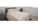 Cozy bedroom with neutral tones, carpet flooring, and a bedside table with lamp at 4698 Lucky Jade Ave, Las Vegas, NV 89141