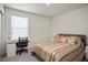Cozy bedroom featuring a comfortable bed, neutral decor, and a functional workspace at 4698 Lucky Jade Ave, Las Vegas, NV 89141