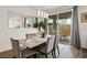 Dining area features modern lighting, large wall mirrors, and access to the backyard at 4698 Lucky Jade Ave, Las Vegas, NV 89141