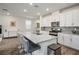 Bright kitchen features a large center island, stainless appliances, and white cabinets at 4698 Lucky Jade Ave, Las Vegas, NV 89141