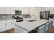 Bright kitchen features stainless steel appliances, a large center island with seating, and ample cabinet space at 4698 Lucky Jade Ave, Las Vegas, NV 89141