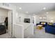Upstairs loft area with comfortable seating, a television, and bright lighting at 4698 Lucky Jade Ave, Las Vegas, NV 89141