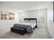 Bright main bedroom with comfortable king bed, carpet floors, and neutral decor at 4698 Lucky Jade Ave, Las Vegas, NV 89141