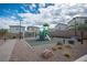 Community playground with modern equipment, seating, and manicured landscaping at 4698 Lucky Jade Ave, Las Vegas, NV 89141