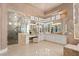 A modern bathroom has marble countertops, and a glass-enclosed shower and is naturally lit at 5020 Spanish Heights Dr, Las Vegas, NV 89148
