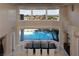 Expansive dining room showcasing high ceilings and views of the pool and manicured landscaping at 5020 Spanish Heights Dr, Las Vegas, NV 89148