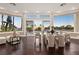 Stylish dining area with glass doors leading to a serene backyard retreat and ample natural light at 5020 Spanish Heights Dr, Las Vegas, NV 89148