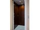 Interior shot of an elevator, wood-paneled with lights, inside the residence at 5020 Spanish Heights Dr, Las Vegas, NV 89148