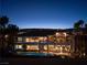 A large two-story home with a pool, balconies, large windows, and mature palm trees at 5020 Spanish Heights Dr, Las Vegas, NV 89148