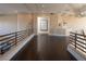 Hallway overlooking the main bedroom, with dark hardwood floors and architectural details at 5020 Spanish Heights Dr, Las Vegas, NV 89148