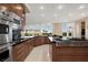 Spacious gourmet kitchen features stainless steel appliances and ample counter space with views at 5020 Spanish Heights Dr, Las Vegas, NV 89148