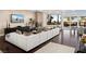 Bright living room with a stone fireplace, comfortable seating, and views of the beautiful backyard at 5020 Spanish Heights Dr, Las Vegas, NV 89148