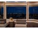 A cozy living room offering gorgeous city views with comfortable seating and lots of natural light at 5020 Spanish Heights Dr, Las Vegas, NV 89148