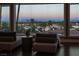 A bright living room offering gorgeous city views with comfortable seating and lots of natural light at 5020 Spanish Heights Dr, Las Vegas, NV 89148